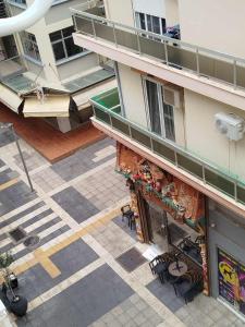 an overhead view of a building with tables and chairs at Faros & Beach View in Alexandroupoli