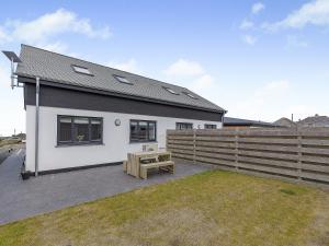 a white house with a bench and a fence at Scilla - Uk50179 in Helston