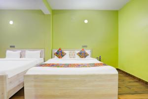 Postel nebo postele na pokoji v ubytování FabHotel Avante Palace