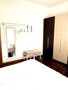 Ένα ή περισσότερα κρεβάτια σε δωμάτιο στο White Home Forli Centro