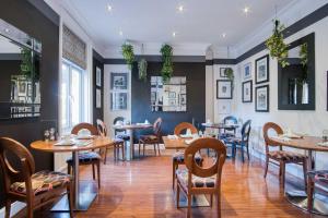 a dining room with wooden tables and chairs at The Helaina in Scarborough +38 photos