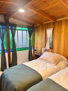 a bedroom with a large bed and a window at YogaLife in Mercedes