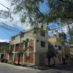 a building on the corner of a street at AKAO HOUSE in Arequipa