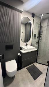 Koupelna v ubytování District 21 + 35 fotografií