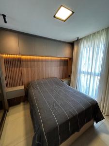 a bedroom with a large bed and a window at RCM Vilas - Studio H Sunrise in Boa Vista +27 photos