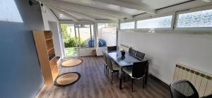 a small dining room with a table and chairs at Maison Bellocier - Quartier gare in Sens