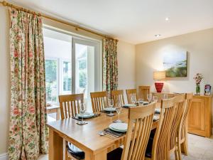 a dining room with a wooden table and chairs at Doxford House - Uk49888 in Preston