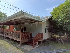 a house with a porch with a roof at Doisaket hills in Doi Saket