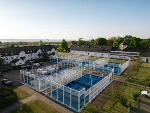 an overhead view of a building with a pool at Luxury Living at Ekerum Öland Heated Pool, Golf & Sea! in Borgholm