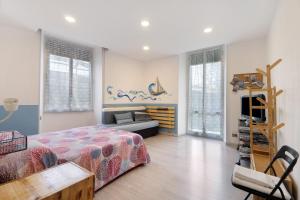 Ένα ή περισσότερα κρεβάτια σε δωμάτιο στο Caruggio al mare