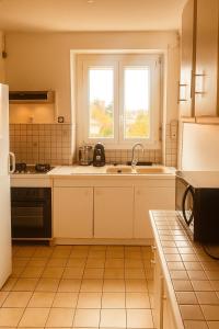 Kuchyň nebo kuchyňský kout v ubytování Duleing House