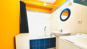 a bathroom with a sink and a toilet at L'air de Stella-Plage au coeur de la Station Balnéaire in Stella-Plage