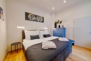 Ένα ή περισσότερα κρεβάτια σε δωμάτιο στο Apartment Luxury +8 φωτογραφίες