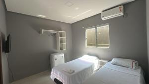 Postel nebo postele na pokoji v ubytování Varandas Hotel