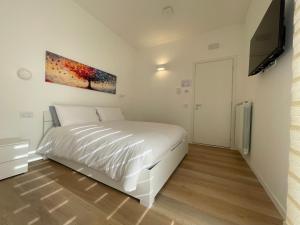 Ένα ή περισσότερα κρεβάτια σε δωμάτιο στο Serendipity Guest Rooms - Foresteria Lombarda