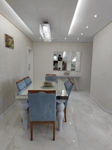 a dining room with a table and chairs at Apartment Seaview all rooms in Florianópolis