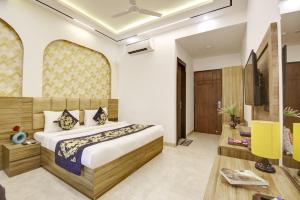 Ένα ή περισσότερα κρεβάτια σε δωμάτιο στο Hotel Armani Free Airport Pickup Aur Drop