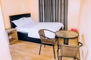 Postel nebo postele na pokoji v ubytování Green Nest Homestay