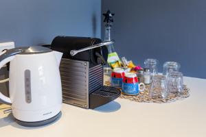 a coffee maker sitting on top of a counter at Amsterdam House of Arts & Crafts in Amsterdam