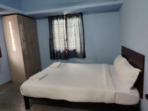 Ένα ή περισσότερα κρεβάτια σε δωμάτιο στο Hotel O Dream inn +16 φωτογραφίες