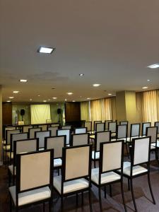 a room with rows of chairs in a conference room at Plaza Hotel in La Rioja +15 photos