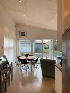 a kitchen and dining room with a table and chairs at Studio apartment in Kivik in Kivik +9 photos