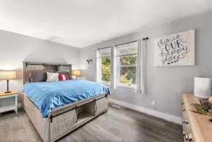 a bedroom with a large bed and a window at Spacious 3 Bedroom in Cary