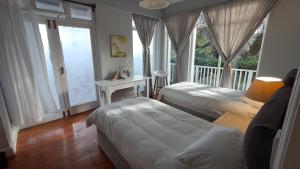 Ένα ή περισσότερα κρεβάτια σε δωμάτιο στο Seaside at The Dunes