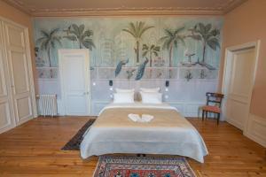 Ένα ή περισσότερα κρεβάτια σε δωμάτιο στο La Léontine