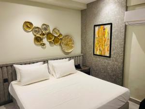 Voodi või voodid majutusasutuse Legacy Dreams Jinnah Super toas