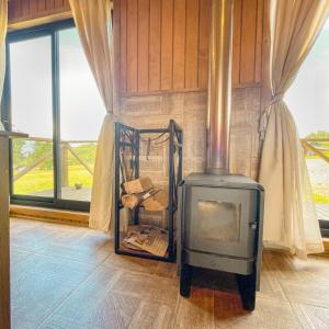 Ένα ή περισσότερα κρεβάτια σε δωμάτιο στο Cabañas Rimü - Cabaña para 2 personas