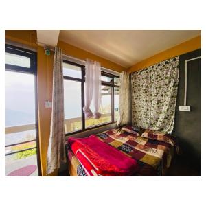 Postel nebo postele na pokoji v ubytování Ridges & Beyond Homestay