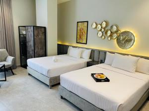 Voodi või voodid majutusasutuse Legacy Dreams Jinnah Super toas