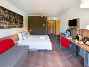 TV a/nebo společenská místnost v ubytování Novotel Poznań Malta