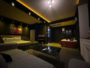 a living room with a couch and a table at My Palace Aırport in Istanbul