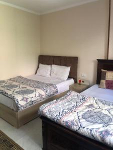 Ένα ή περισσότερα κρεβάτια σε δωμάτιο στο Two bedroom Apartment in central location in downtown Cairo