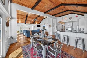 a kitchen and living room with a table and chairs at PW1310: 1310 Pelican Watch in Seabrook Island