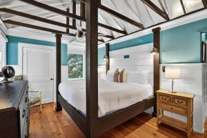 a bedroom with a large bed and blue walls at PW1310: 1310 Pelican Watch in Seabrook Island +43 photos