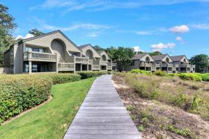 a walkway leading to a house at PW1357: 1357 Pelican Watch in Seabrook Island