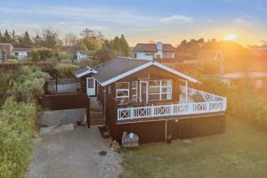 an overhead view of a house with a porch at Active Coastal Holiday In Cozy Cottage in Strandlyst