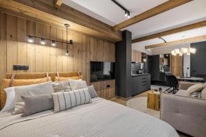 Η κουζίνα ή μικρή κουζίνα στο Aparthotel Białka SKI, Odkryj-Bialke +35 φωτογραφίες