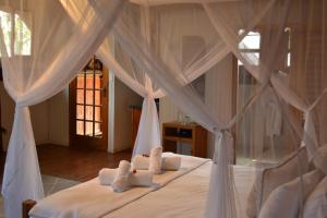 Ένα ή περισσότερα κρεβάτια σε δωμάτιο στο Vida Nova Kruger