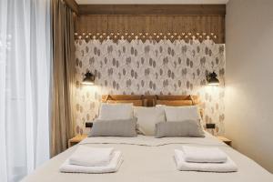 Ένα ή περισσότερα κρεβάτια σε δωμάτιο στο Aparthotel Białka SKI, Odkryj-Bialke