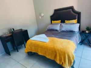 Postel nebo postele na pokoji v ubytování Lukhanya Guesthouse