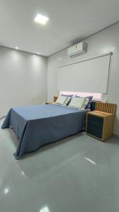 En eller flere senge i et værelse på Casa Conforto + 12 billeder