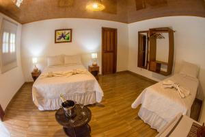 Postel nebo postele na pokoji v ubytování Evolução Ecolodge