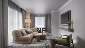 a living room with a couch and a table at InterContinental Hotels Table Bay Cape Town by IHG in Cape Town