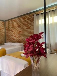 Ένα ή περισσότερα κρεβάτια σε δωμάτιο στο Pousada Flor do Café +14 φωτογραφίες