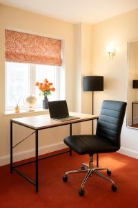 an office with a desk with a laptop on it at Sunnyholme - New! Yorkshire Luxurious Cottage in Hawes