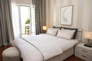 Postel nebo postele na pokoji v ubytování Monte Aria panorama suites + 79 fotografií